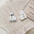 Macro detail of hand-painted ceramic dalmatian puppy beads with dual-hole design for DIY crafts - Style 19
