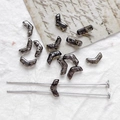 Detail of silver-spotted V-shape Czech glass beads with two-hole structure for DIY jewelry - Antique Silver Black/Gunmetal