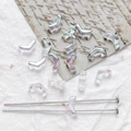 Macro shot of iridescent V-shaped Czech glass beads with two holes for DIY jewelry making - Iridescent Translucent
