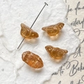 Macro detail of amber bird glass beads with gold wing texture for DIY jewelry making - Translucent Amber Bird (10#)