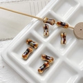 Macro detail of bone-shaped ceramic beads with brown and white flowing glaze texture - 8# Brown Quicksand Style (D5347) / 1 Piece