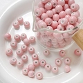 Macro shot of glossy pink ceramic beads for DIY jewelry making in a glass measuring cup - Style 6 (8mm/10 Pieces/Pack)