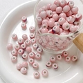 Close-up of pink glazed ceramic beads with wide holes for DIY jewelry making - Style 7 (8mm/10 Pieces/Pack)