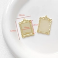 Detailed macro view of 18k gold plated vintage photo frame pendant with 32x22mm dimensions - Shell Edge Oval Style (2#) / Gold