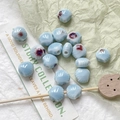 Macro-opname van lichtblauwe keramische kralen met paarse glazuurvlekken voor DIY sieraden - Lichtblauwe Gevlekte Glanzende Kraal (3# 1 Stuk)