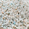 Detailed view of 4mm cream beads with marble texture and gold glitters for jewelry DIY - 10g Pack / Color 3 (Cream with Ink Splash)