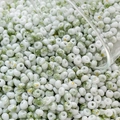 Macro shot of 4mm cream beads with green fog texture and gold foil flakes for DIY jewelry - 10g Pack / Color 6 (Grass Green Cloud Pattern)