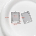 Detailed view of silver-tone Baroque photo frame pendant showing front and back texture - Wheat Ear Rectangle Style (12#)