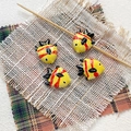 Close-up of four handmade yellow ceramic tropical fish beads with red stripes for DIY jewelry - 7# (Bright Yellow Red Stripes)