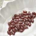 Macro view of fish-shaped glass beads in dark amber finish for jewelry making - 3# Dark Brownish Red