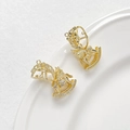 Macro detail of gold-plated rocking horse pendant with cubic zirconia wings - Pegasus Style with Pearl / 18K Gold
