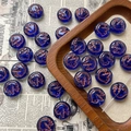 Macro detail of 10mm dark blue Czech glass beads with hand-painted gold dove patterns - Dark Blue Bird Style / 1 Piece Pack