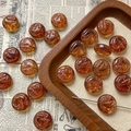 Detailed macro view of amber glass beads with bird relief for DIY jewelry making - Amber Bird Style / 1 Piece Pack
