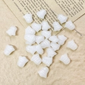 Macro detail of white bell-shaped Czech glass beads for vintage DIY jewelry making - White Style (1#)