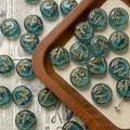 Macro detail of hand-painted golden bird on teal Czech glass bead for DIY jewelry - Cyan Blue Bird Style / 1 Piece Pack