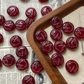 Macro view of vintage dark red Czech glass beads with embossed bird motif for DIY jewelry - Wine Red Bird Style / 1 Piece Pack
