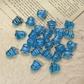 Close-up of blue transparent glass bell beads for DIY jewelry making on vintage paper - Blue Style (8#)