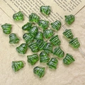 Macro view of green transparent bell-shaped glass beads with silver decorative lines - Green Silver Pattern Style (9#)