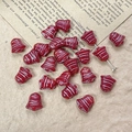 Detail of red Christmas bell glass beads on vintage paper for DIY jewelry making - Red Style (11#)