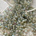 Macro shot of iridescent frosted Czech glass beads for DIY jewelry and embroidery - 10# / 10 Pieces Pack