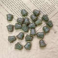 Macro shot of bell-shaped glass beads with copper etching on vintage script paper - Gray Green Style (14#)