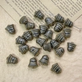 Macro shot of vintage bell-shaped Czech glass beads with antique gold stripes for jewelry DIY - Dark Gray Style (13#)