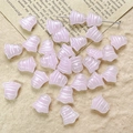 Close-up of light pink bell-shaped Czech glass beads for DIY vintage jewelry making - Pearly Pink Style (26#)