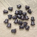 Macro shot of black and bronze bell-shaped Czech glass beads for DIY jewelry making - Black Bronze Style (35#)