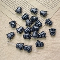 Close-up of black bell-shaped glass beads with silver ridges for DIY jewelry crafting - Black Silver Style (36#)