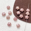 Macro shot of faceted pink natural stone star beads for DIY jewelry making and crafts - Rose Quartz