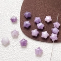 Macro detail of purple star-shaped natural stone beads with holes for DIY jewelry crafting - Lilac Stone