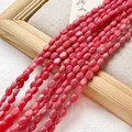 Détail macro de perles ovales en pierre naturelle rose avec texture en spirale - 1 Pièce / Style Texture Spirale Rose (5#)