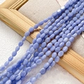 Détail de perles d'agate ovales bleu clair avec veines naturelles sur tissu de lin - 1 Pièce / Style Texture Veinée Bleue (7#)
