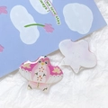 Macro detail of acrylic kite-shaped charms with floral and star patterns for DIY jewelry - Pink Swallow Kite Style