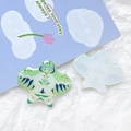 Macro detail of acrylic kite charms with colorful resin finish and translucent texture - Blue And White Swallow Style