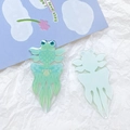Detailed macro view of mint green acrylic goldfish charm with printed fish scale textures - Mint Green Goldfish Style