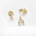 Detailed view of 18k gold plated jewelry clasps with vintage scroll patterns and blue gems - 18K Gold