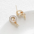 Detail showing 18k gold plated round stud earring with mother of pearl and zircon stones - 18K Gold