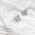 Macro shot of silver bow pendants for DIY jewelry with 13mm by 11mm size detail - 3D Bright Silver Bow Pendant (25#)