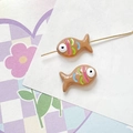 Close-up of hand-painted caramel fish beads with colorful stripes for DIY jewelry making - Caramel Brown Style (13#)