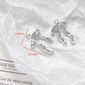 Silver bow pendants for DIY jewelry making with polished metal finish and hanging loops - Dynamic Silver Bow Charm (28#)