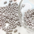 Macro view of grey-purple dumbbell-shaped ceramic beads for DIY jewelry making - Silver Grey