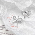 Macro shot of silver bow pendant with 19mm x 16mm dimensions for DIY jewelry making - Knotted Silver Bow Charm (30#)