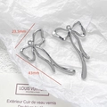 Polished silver metal butterfly bow pendant measuring 43mm by 23.5mm with top hanging loop - Large Bright Silver Bow (31#)