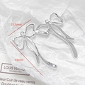 Silver bow-shaped metal pendants with hammered texture and 43mm height dimensions - Wavy Silver Bow Charm (32#)