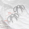 Detailed view of silver bow-shaped DIY jewelry charms with 30mm x 20mm dimensions - Hollow Silver Bow Charm (33#)