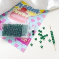 Detail showing 4mm frosted green glass seed beads with storage box and DIY sewing needle - Dark Green