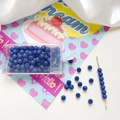 Macro view of 4mm dark blue glass beads set with plastic storage case and needle - Dark Blue