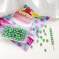 Detailed view of 4mm frosted green glass beads with storage box and craft needle tools - Pale Green