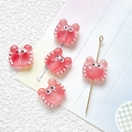 Macro shot of 5 pink translucent crab glass beads with white dots for DIY jewelry making - Peach Pink (3#)